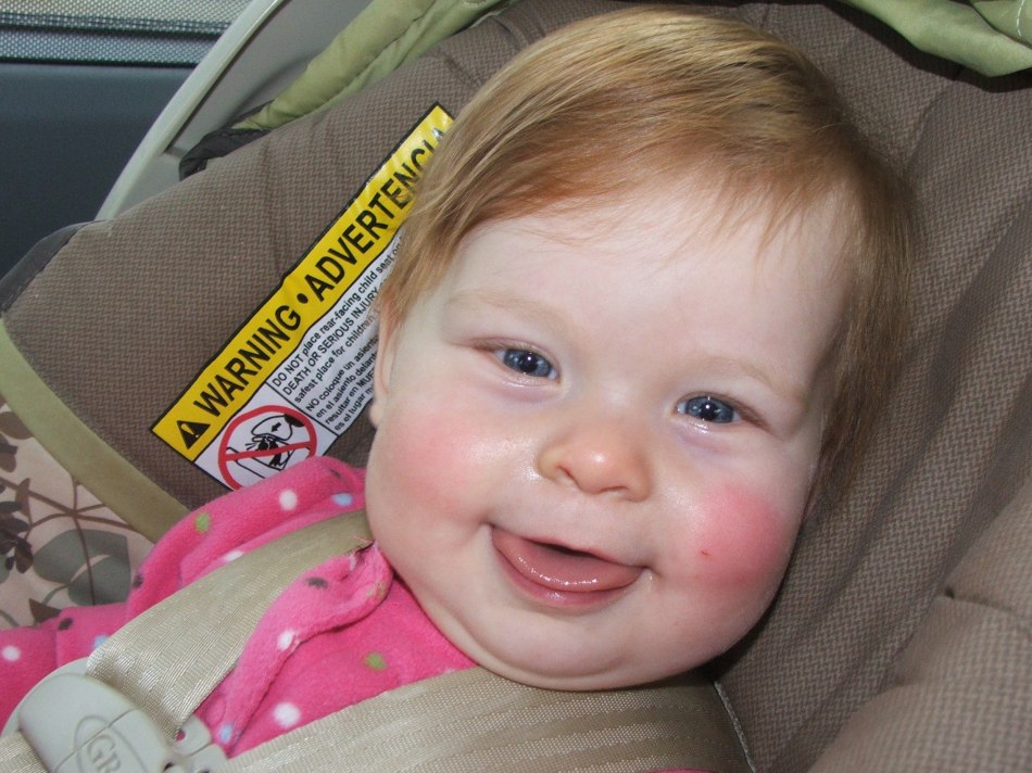 Violet clowing in the carseat